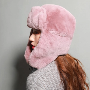 Pink plush trapper hat for winter with ear flaps and thick warm lining for women