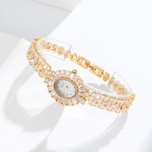 Luxury gold women's watch with mother of pearl dial and sparkling crystals
