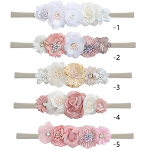 Set of five handmade floral baby headbands with soft nylon elastic in various pastel colors