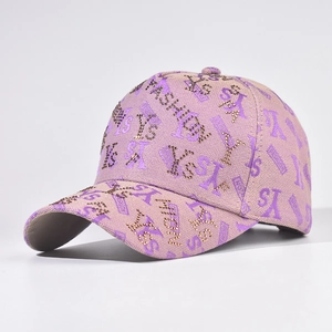 Detailed side view of pink baseball cap with rhinestone FASHION and YES embroidery