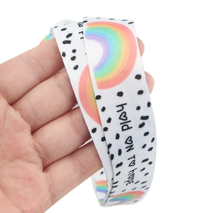 Close-up of white rainbow lanyard with black spots and hold ON TO hope text print
