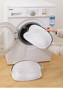 Close-up of durable white mesh laundry bag with zipper for machine washing shoes