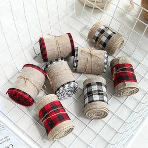Plaid burlap ribbon rolls for Christmas gift wrapping in a white wire basket decor