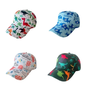Set of four kids baseball caps featuring various dinosaur and sea life animal prints