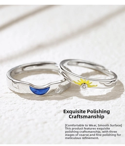 Detailed close-up of sun and moon couple rings with blue and yellow enamel inlay