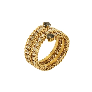 Golden multi-layer braided open ring with white zircons and black gemstones on white back