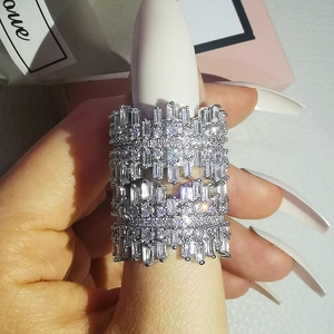 Macro detail of irregular wide silver ring featuring pavé set rectangular cubic zirconia