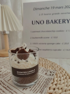 Close-up of strawberry chocolate dessert style scented soy candle in a glass jar