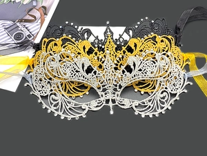 Detail showing black gold and silver lace masquerade masks with rhinestone accents