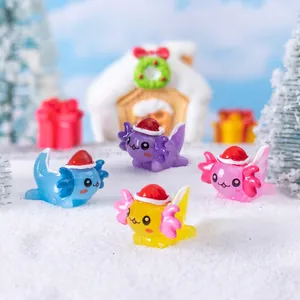 Miniature Christmas axolotl figurines in four colors with Santa hats on artificial snow