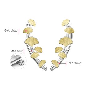 Detailed macro view showing the S925 sterling silver stamp and gold plating on ginkgo leaf earrings