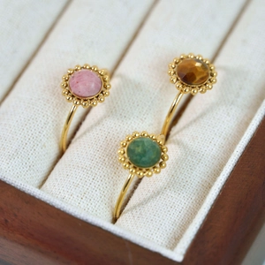 Vintage French stainless steel rings with colorful faceted natural stones in gold milgrain settings