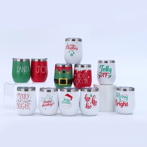 Close-up of assorted 12oz Christmas themed insulated egg-shaped tumblers in festive colors