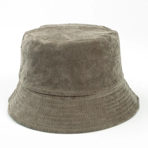 Close-up of deep gray corduroy bucket hat showing thick vertical ribbed texture
