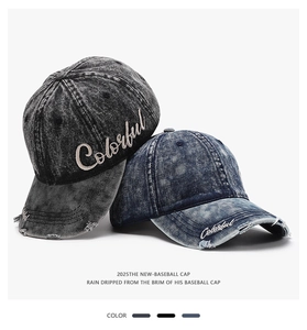 Detailed view of distressed baseball caps with Colorful embroidery and vintage wash texture