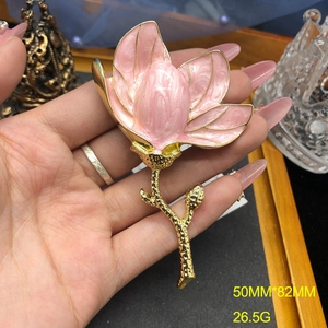 Detail of pink magnolia brooch with enamel petals, measuring 50mm by 82mm size