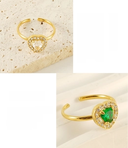 Detailed macro of adjustable 18K gold plated stainless steel rings with heart shaped zircons