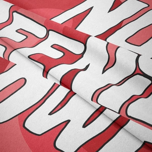 Macro shot of bohemian tapestry fabric showing soft texture and artistic typography detail