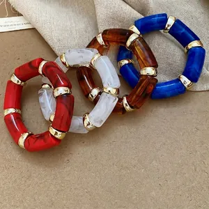 Acetate resin beaded bracelets with marble patterns and gold metal spacers