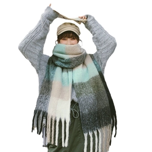 Rainbow striped winter scarf with chunky knit texture and long tassel fringe detailing