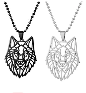 Detail of hollow geometric wolf head pendants in black and silver finishes on bead chains