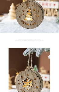 Detail of wooden Christmas LED hanging ornaments with snowflake and tree cutout designs