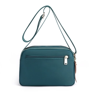 Waterproof dark green nylon crossbody bag for women with multiple zip pockets and gold hardware
