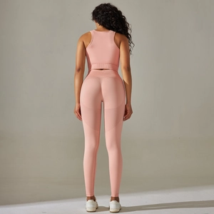 Close-up of pink seamless yoga set back view showing peach lift contour and mesh panels
