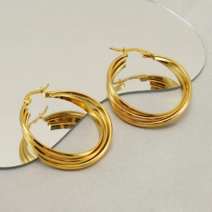 Polished gold multi-layer stainless steel hoop earrings with triple-ring geometric design