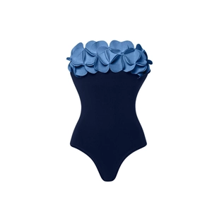 Detailed view of the 3D flower petal appliques on this navy blue one-piece swimsuit
