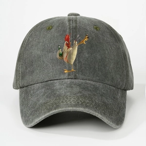 Detailed macro view of washed grey cotton baseball cap featuring a rooster graphic print