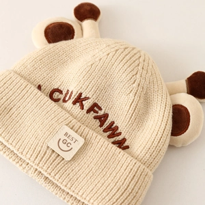 Winter knitted baby hat with brown animal ears and Lucky embroidery in beige