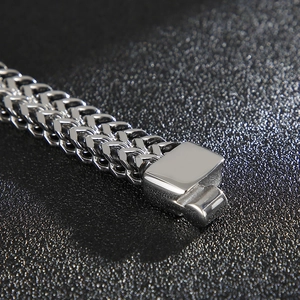 Detailed macro view of the silver stainless steel Franco chain with a secure fold-over clasp