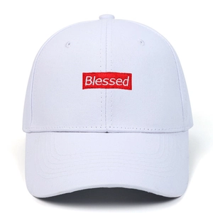 White cotton baseball cap with red Blessed box logo embroidery and minimalist design