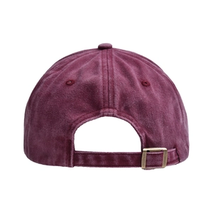 Detail of vintage washed cotton baseball cap back with bronze metal adjustable buckle