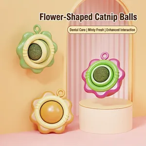 Flower shaped catnip balls in green, pink and yellow with plastic shell for cat dental care