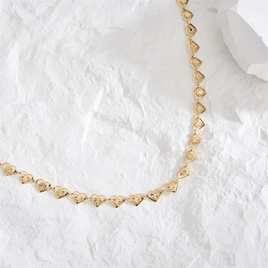 Gold-plated heart pendant necklace with hollow starburst pattern for elegant women