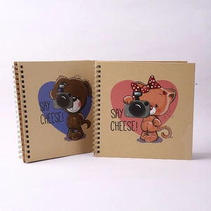 Two 6-inch spiral kraft paper scrapbooks with cartoon dog and cat 'SAY CHEESE' designs