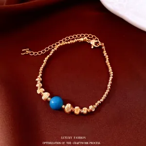 Bracelet à perles plaqué or 18 carats avec touche bleu turquoise et charme de cœur