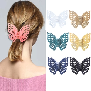 Detailed close-up of hollow butterfly hair claws in various colors for women's hairstyles