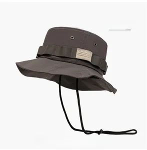 Close-up of dark grey quick-dry bucket hat featuring breathable mesh and chin strap
