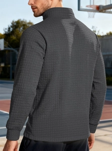 Detail view of men's dark grey waffle knit sweatshirt with stand collar from back side
