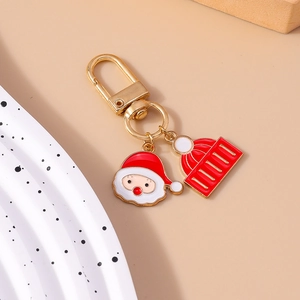 Cartoon Santa Claus and Christmas hat alloy enamel keychain hanging on a gold clasp
