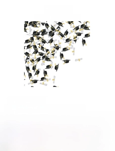 Detail of 100pcs graduation party confetti featuring cap and scroll paper designs