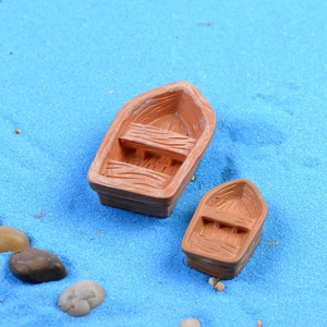 Miniature resin brown rowboat models on blue sand for moss micro landscape decor