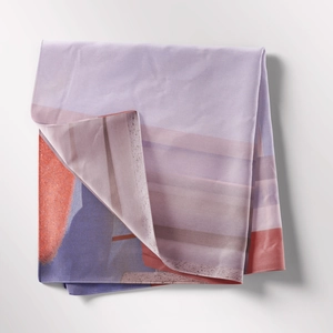 Macro detail of Bohemian tapestry fabric showing abstract purple prints and fine stitching