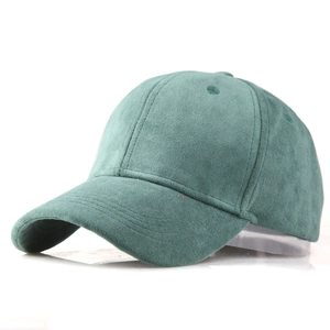 Detailed close-up of dark green faux suede baseball cap showing soft brushed texture