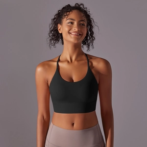 Detail view of black sports bra with thin straps and high-elastic seamless fabric