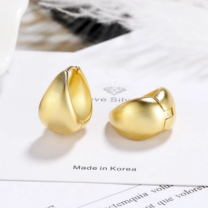 French retro matte gold water drop earrings made of silver on a white card background
