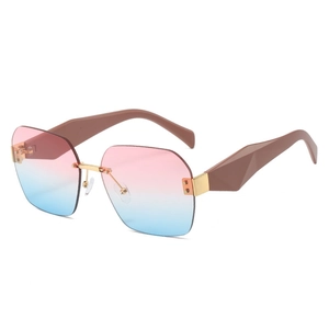 Fashionable rimless square sunglasses with pink blue gradient lenses and brown geometric temples